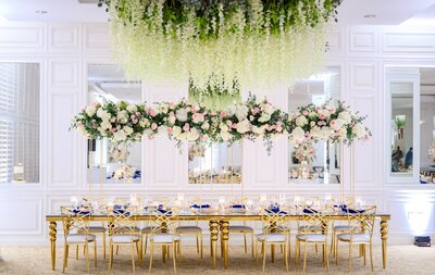 Photo of the room with greenery hanging and gold table, Destination Wedding at The Palms Hotel in Miami, FL