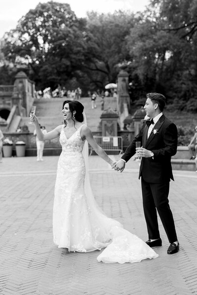 A candid portrait of the Bride and Groom while walking around Central Park during their portraits.