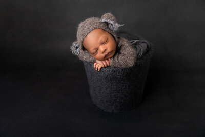 newborn photoshoot with  gray outfit