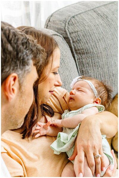 Mom and Dad looking at their new baby girl.  Pittsburgh PA Newborn Photographer
