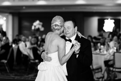 Father of the bride dancing with his daughter on her wedding dya