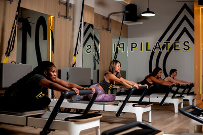 Woman on Pilates reformer during Pilates class at Pilates214 in Dallas.