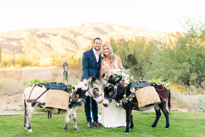 couple with beer burros at Tanque Verde Ranch barn wedding