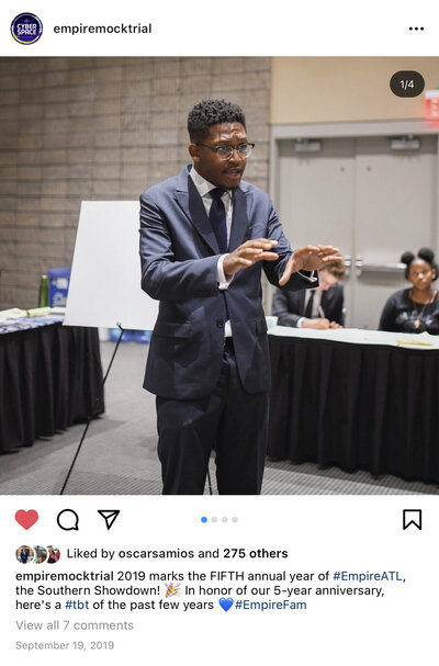 Instagram post and copy showing male student presenting an opening statement.