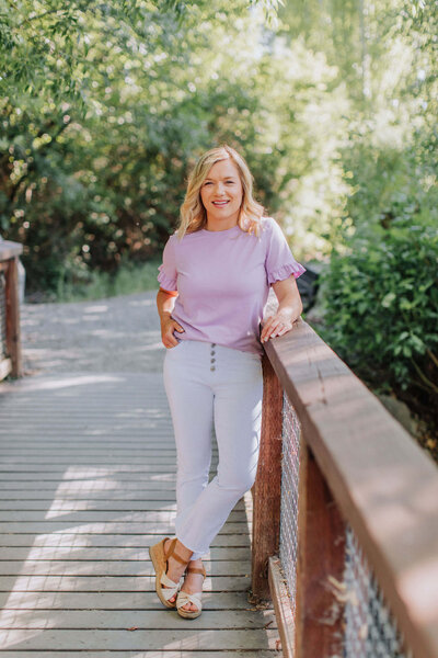 Brandy the brightly balanced classroom standing on a bridge