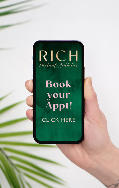 This is an image of an iphone mockup with the logo and book your appointment on it. Rich Medical Aesthetics booking.