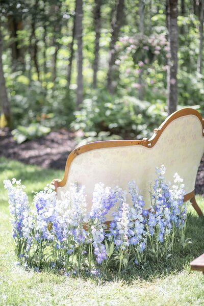 Sofa surrounded by flowers at Wedding Ceremony in Wisconsin