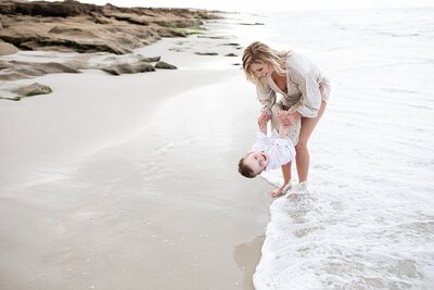 Mom playing with son on the beach for their Orlando Portrait Photography session