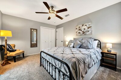 Bedroom with Queen bed in this Entry way of this three-bedroom, two-bathroom vacation rental home featured on Chip and Joanna Gaines' Fixer Upper located in downtown Waco, TX.