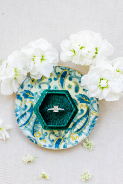 Close up of engagement ring in emerald green ring box