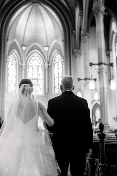 bride and father of the bride walking down the aisle in cleveland wedding