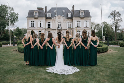 Bride with her bridesmaids at her wedding at a chateau in France