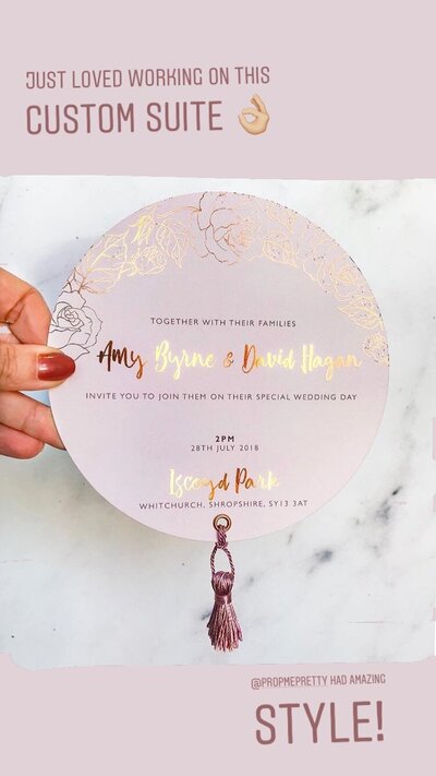 Circular foiled wedding invitation with tassel