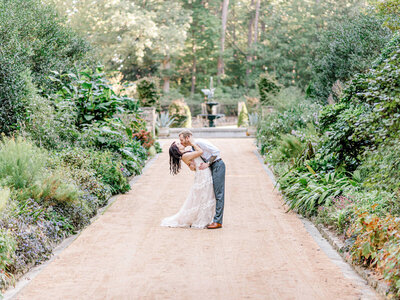 bride and groom dip kiss at Sarah P. Duke Gardens