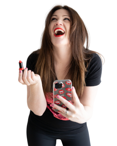 Emily holding lipstick and her cell phone with a lip pattern case, looking up and smiling