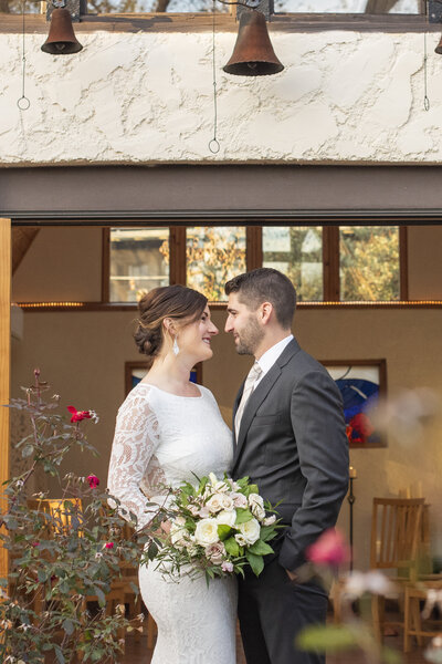 Couple with roses in Asheville NC wedding photography tiny chapel