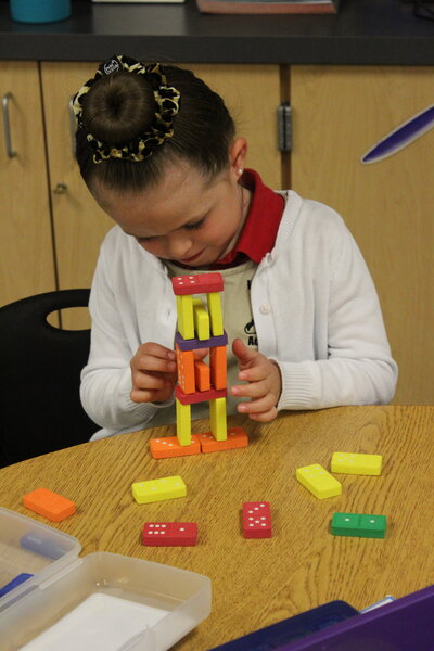 Kindergarten students using clicks to build while learning math and engineering