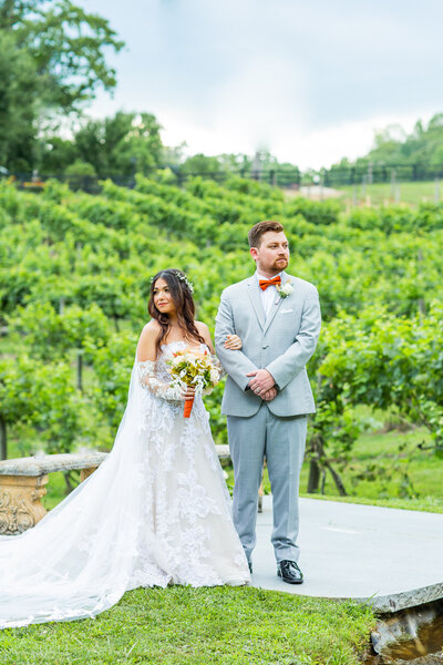 engaged couple posing on a golf course