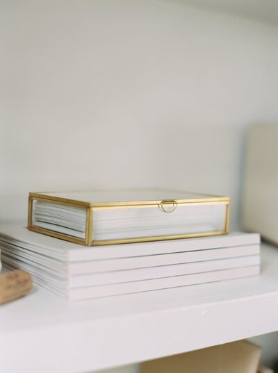 shelf with glass box of photography prints