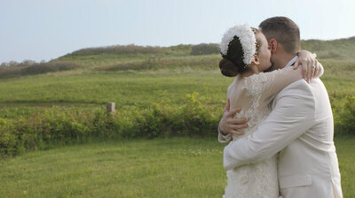 Bride and groom standing outside Old Whaling Church in Edgartown MA