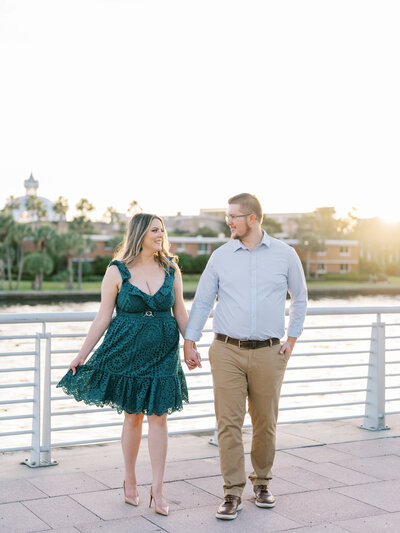 couple walking together outside during portrait session in Tampa