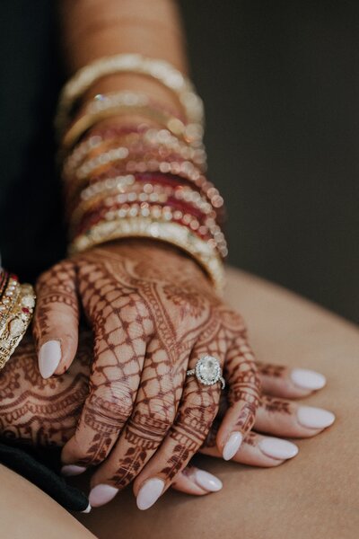 Picture of bride's hands with henna and wedding ring