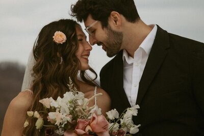 An intimate moment between a young couple celebrating their elopement in the western north carolina mountains.