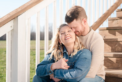 couple smiling during engagement photos in Kentucky 