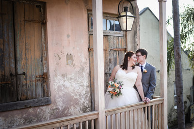 Bride and Groom on balcony at Race & Religious, New Orleans Wedding