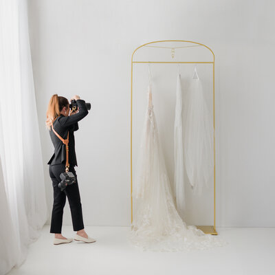 female wedding photographer capturing bridal suite. behind the scenes look.