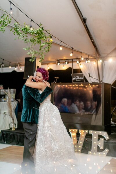 couple shares an embrace on the dance floor in asheville nc