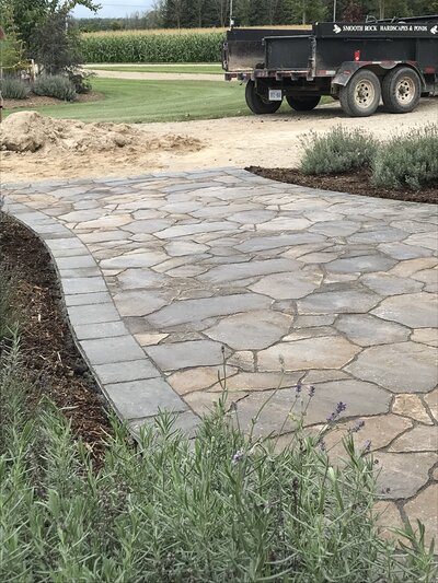 landscape installation with flagstone pathby Helena's Gardening