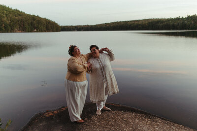 Couple posing by the water - UME (New England Wedding Planners were wedding vendors)