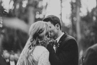Bride and groom kiss after taking vows