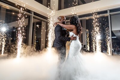 Black wedding couple dancing on clouds with sparklers at Ventanas Wedding Venue photo take by Bonnie Blu