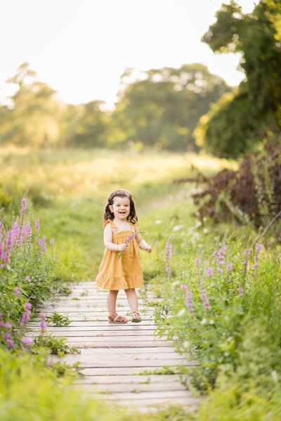 little girl twirling in a dress during family session