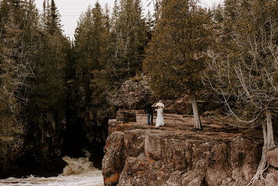 Bride and Groom walking along the bluffs of the Temperance River Gorge in Tofte MN