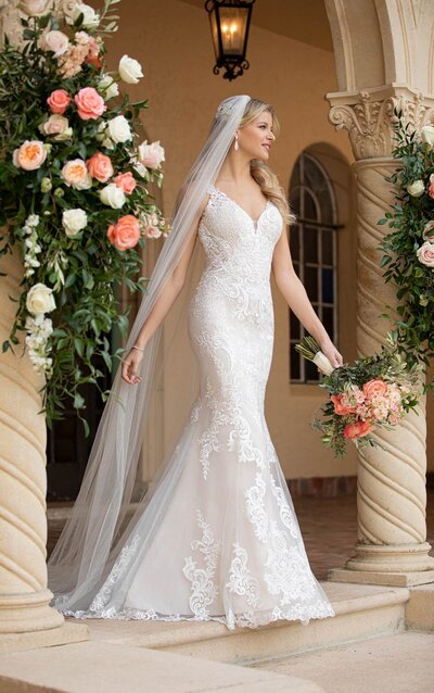 GARDEN-INSPIRED OFF-SHOULDER WEDDING GOWN Garden beauties, meet your match. This wedding gown from Stella York has it all for the botanical-inspired princess bride! With an overall lightweight feel, this gown offers a modern alternative to traditional lace styles. The sweetheart neckline is youthful and feminine on its own as a strapless style, or you can amp up the princess vibe with the detachable organic lace straps! Large-scale embroidered laces feature various organic shapes throughout the bodice, and increase in size as they fall over the waistline and throughout the A-line skirt for a windswept effect. The laces also feature delicate sequin detailing throughout the embroidery, producing a dew-like shimmer to enhance your natural glow! Horsehair finishing keeps the skirt feeling fresh and lightweight, while maintaining a full shape. A very slight train follows behind the silhouette for a touch of traditional style and all of the manageability. This gown is also available in plus sizes.