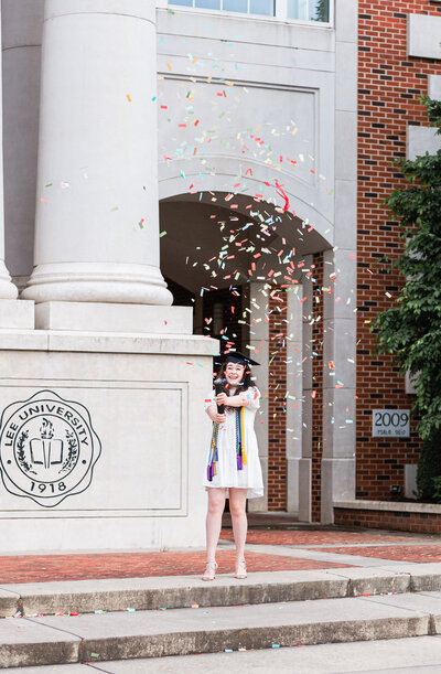 college senior popping confetti at Lee University