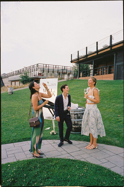 35mm film photo of fashionable guests during cocktail hour in Kelowna