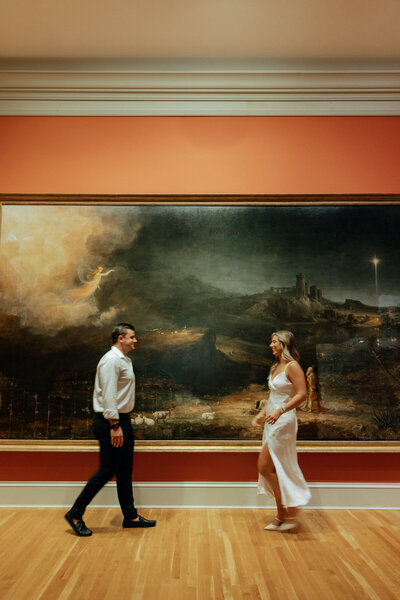 bride and groom walking towards each other art museum elopement
