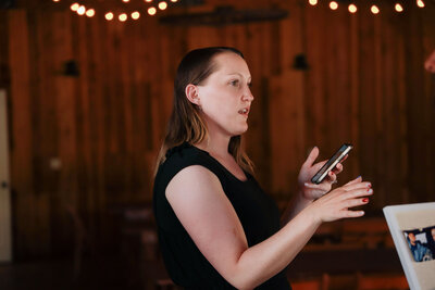 Seattle Wedding Coordinator shows how she directs wedding and holding phone