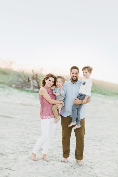 A photo of Jenna Davis, from Jenna Davis Photography, and her family. Jenna has a husband and two sons.