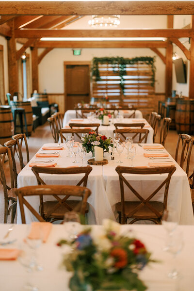 table settings in the barn at barnwood events in madison, winconsin.