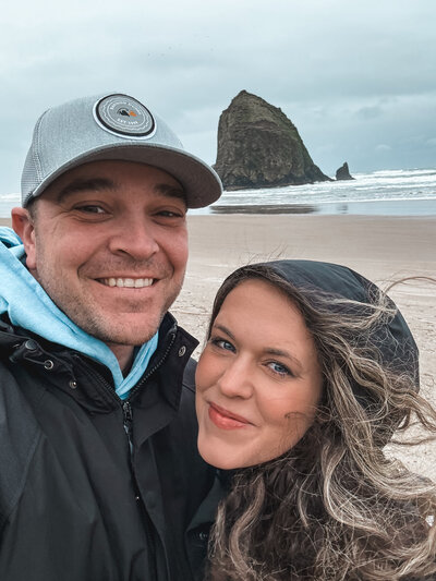Ronny and rene, oregon wedding photographer, poses at Cannon beach