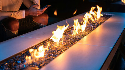 Fire table with fire at nighttime. 