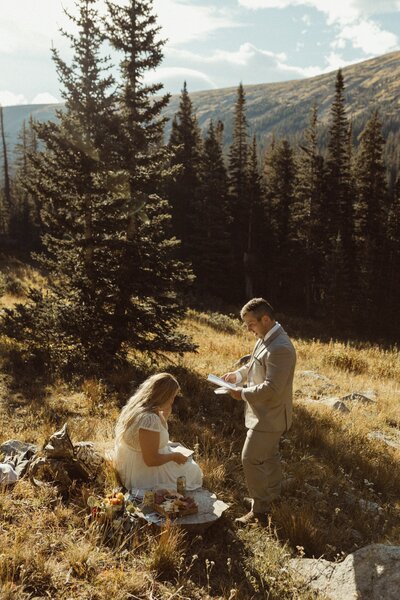 A Couple reading letters from their family after eloping in Colorado