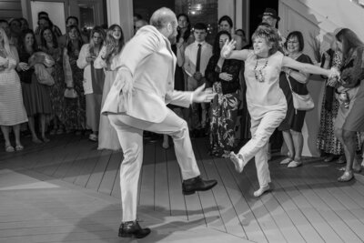 A son dancing with his mother at his wedding reception in Atlantic Beach by Wilmington wedding photographer, JoLynn Photography