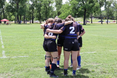 Women's Rugby Team Pre-game huddle - Zoomie Rugby