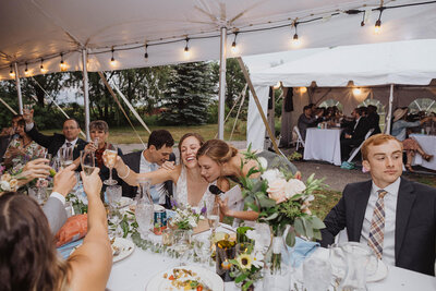 bride raising a glass for a toast during denver colorado wedding